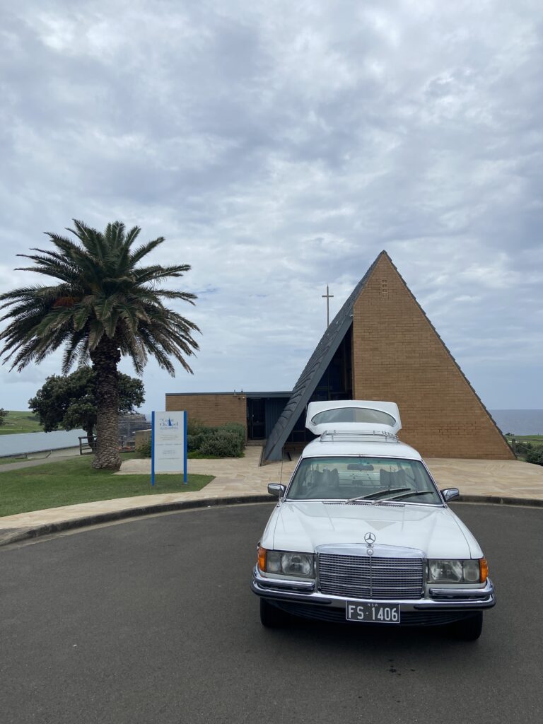 Coast Chapel Outside with white hearse